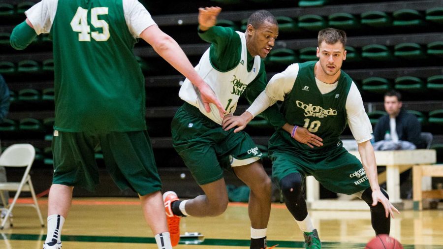 Senior Wes Eikmeier, 10, drives past Jordan Mason, 14, in practice Monday morning before the team left for Vegas. Today the Rams will play their first game in the Mountain West Tournament at 2:30 p.m. against Fresno State in Las Vegas.