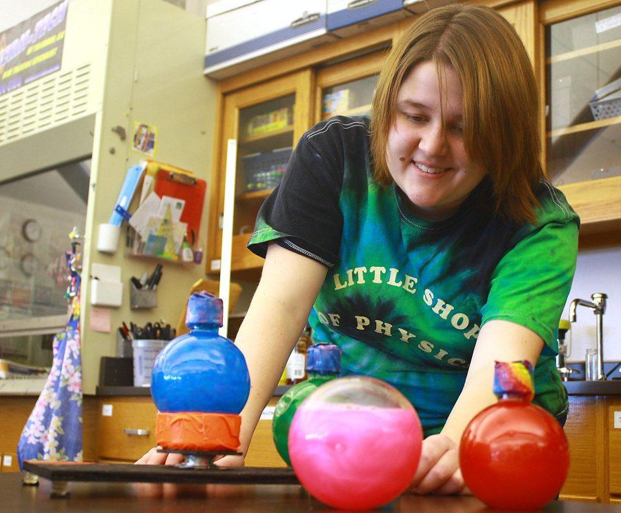 Anthropology major Haeli Leighty tests one of the many mind boggling scientific displays in the Little Shop of Physics lab. The Native American Cultural Center is teaming up with the Little Shop of Physics to give the communitys youth a chance to learn about College.