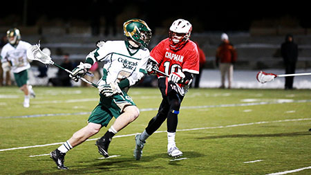Tim Taggart (8) goes on the attack against Chapman defenders. The victorious Rams scored twice in the last five minutes of the game to tie it up and lead them to overtime.