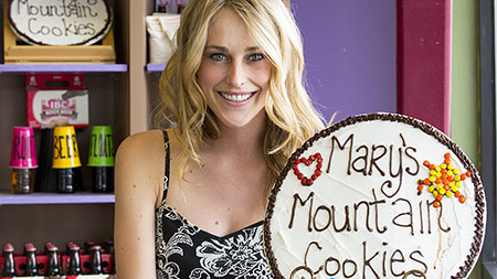 Founder of Chefs On the Go, Christina Minihan, poses at the cookie store she often visits with her business. Chefs On the Go brings kids to local restaurants to learn how to cook from the chefs.