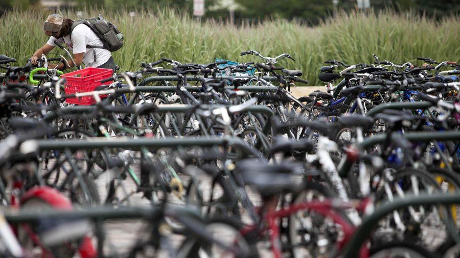 Liberal Arts major Eric Feldman locks up his bike amoung a sea of others outside of the Rec Center. ASCSU and local govenment are discussing the prospects of starting a bike-sharing program that would be similar to the one seen in Denver.