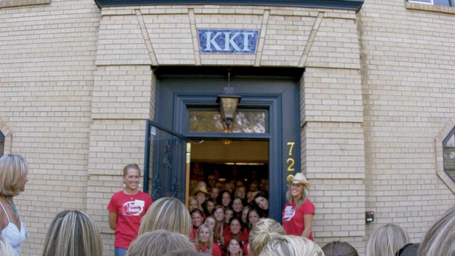Members of the Kappa Kappa Gamma sorority sing to rushes in front of their house on Shield Street and Plumb Avenue. University data shows Greek students have typically had higher GPAs than non-Greek students.