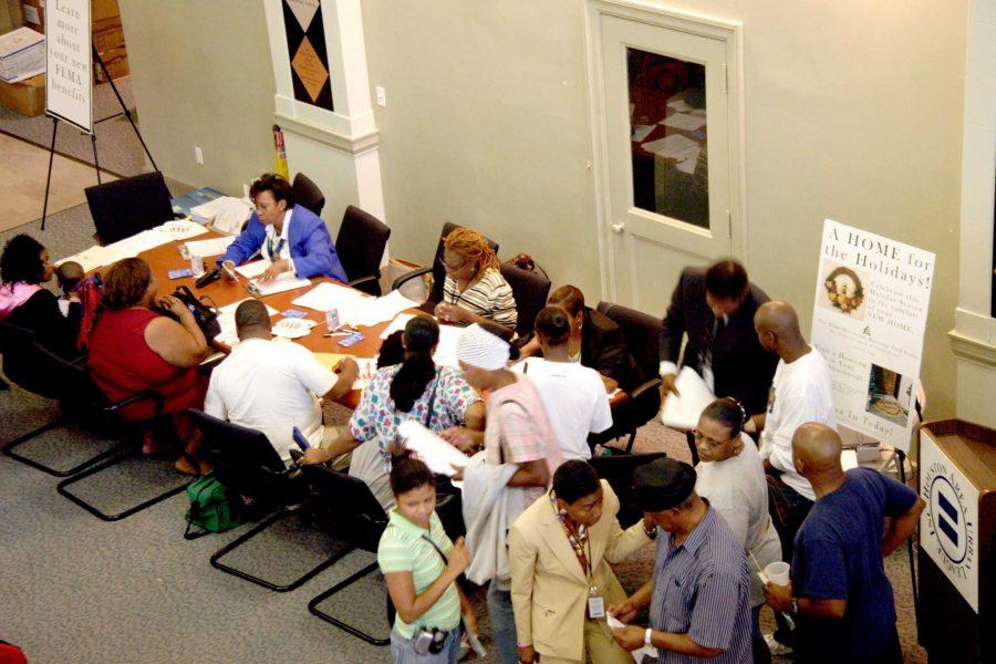 Houston, TX, November 10, 2005- Applicants sign up for housing assistance at the Houston Urban League Housing Fair.  CR workers are working now to get clients into more permanent housing.  Photo by Ed Edahl/FEMA