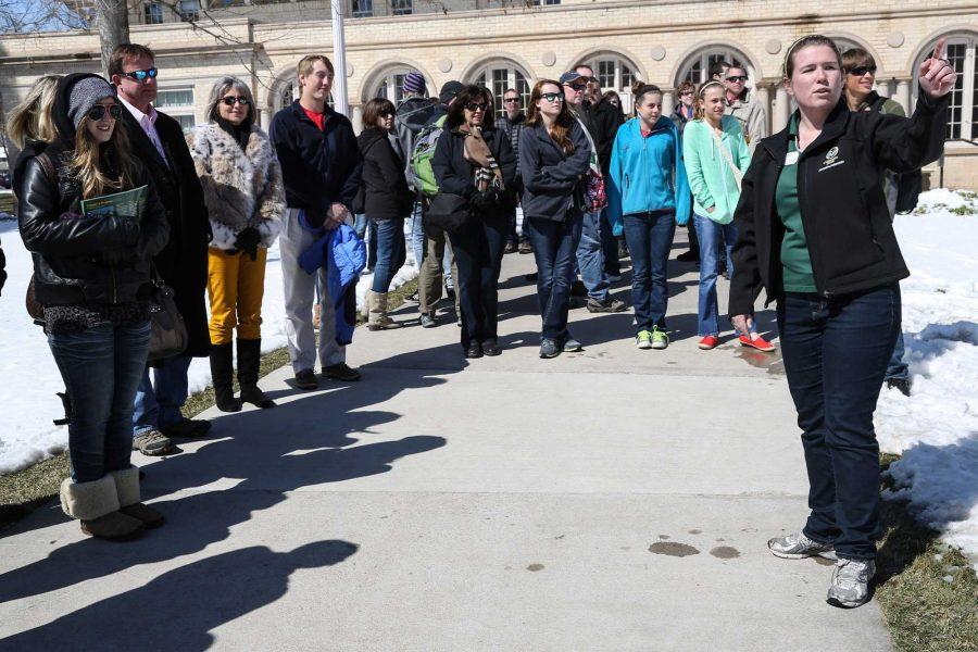 Senior environmental health major Mary-Kate Franks directs a campus tour of mostly high school freshman outside of the Wlecom Center Monday afternoon. For many incoming freshmen, coming to college can be a daunting task.