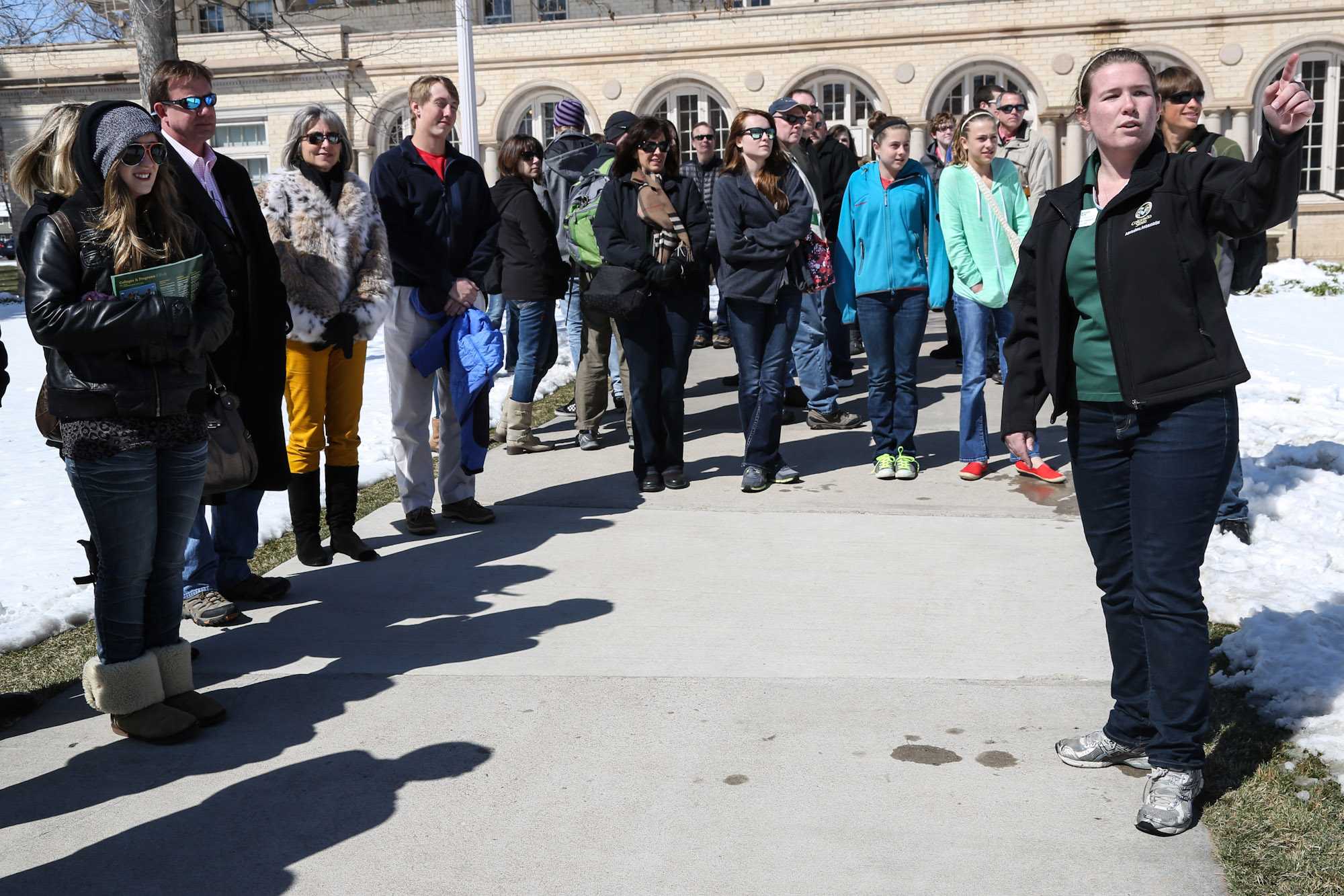 Senior environmental health major Mary-Kate Franks directs a campus tour of mostly high school freshman outside of the Wlecom Center Monday afternoon. For many incoming freshmen, coming to college can be a daunting task.