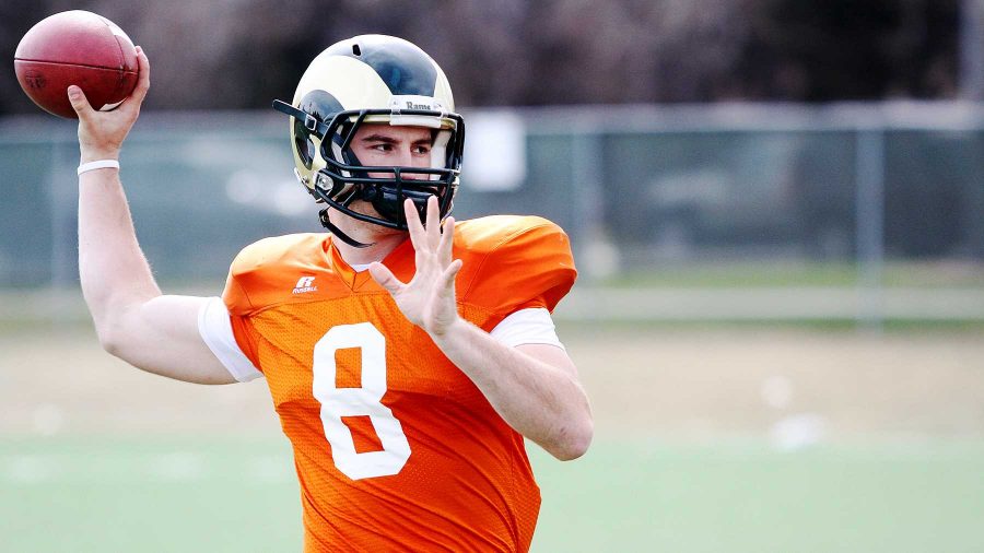 Craig Leonard, 8, about to throw the ball down field at practice Monday evening. Leonard was a red shirted freshman this year.