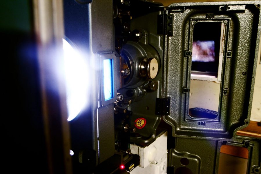 The inside of a film projector displays a film to Cinema Lyric audiences. After April 11th the Cinema Lyric will have completely transitioned to digital film.