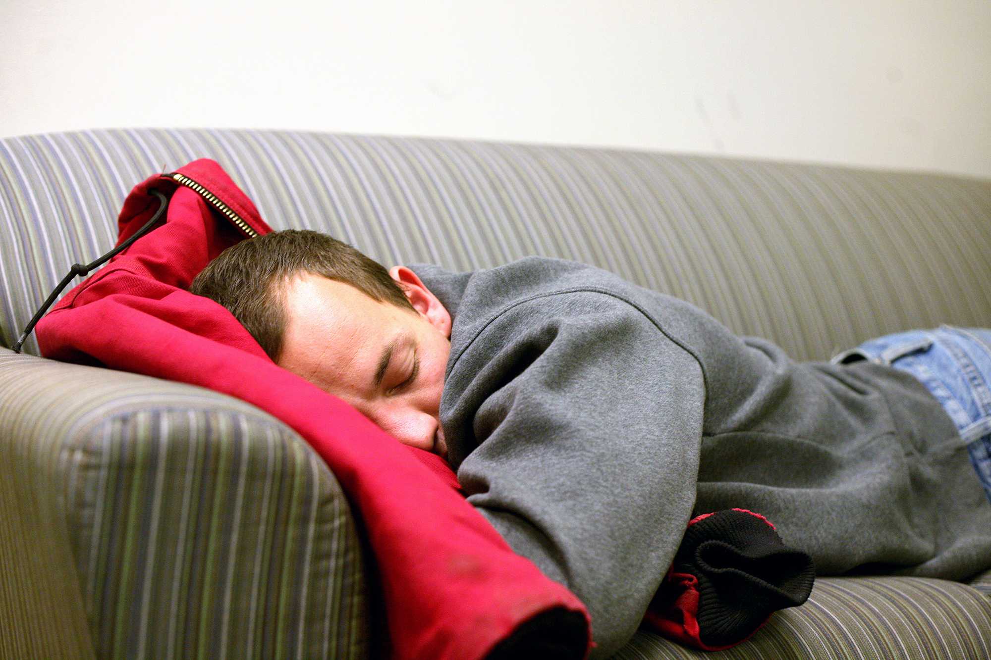 Anthony Puerini takes a nap while waiting to meet up with his girlfriend in between her classes Tuesday. Some universities, like Harvard, awknowlege the benefits of napping and even provide their students with designated napping spaces.