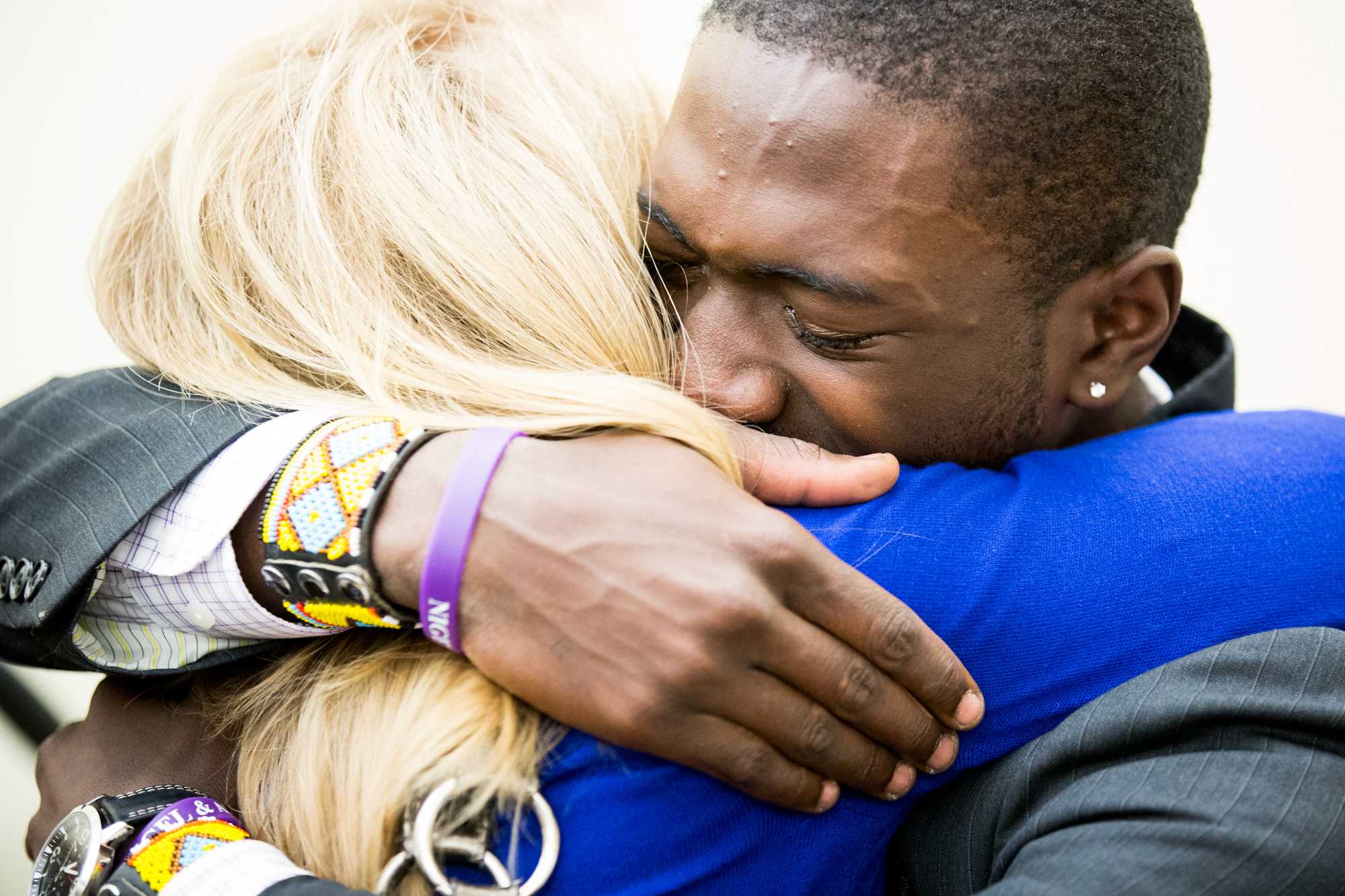 Director of SLICE Pamala Norris, left, hugs ASCSU President Elect Nigel Daniels.