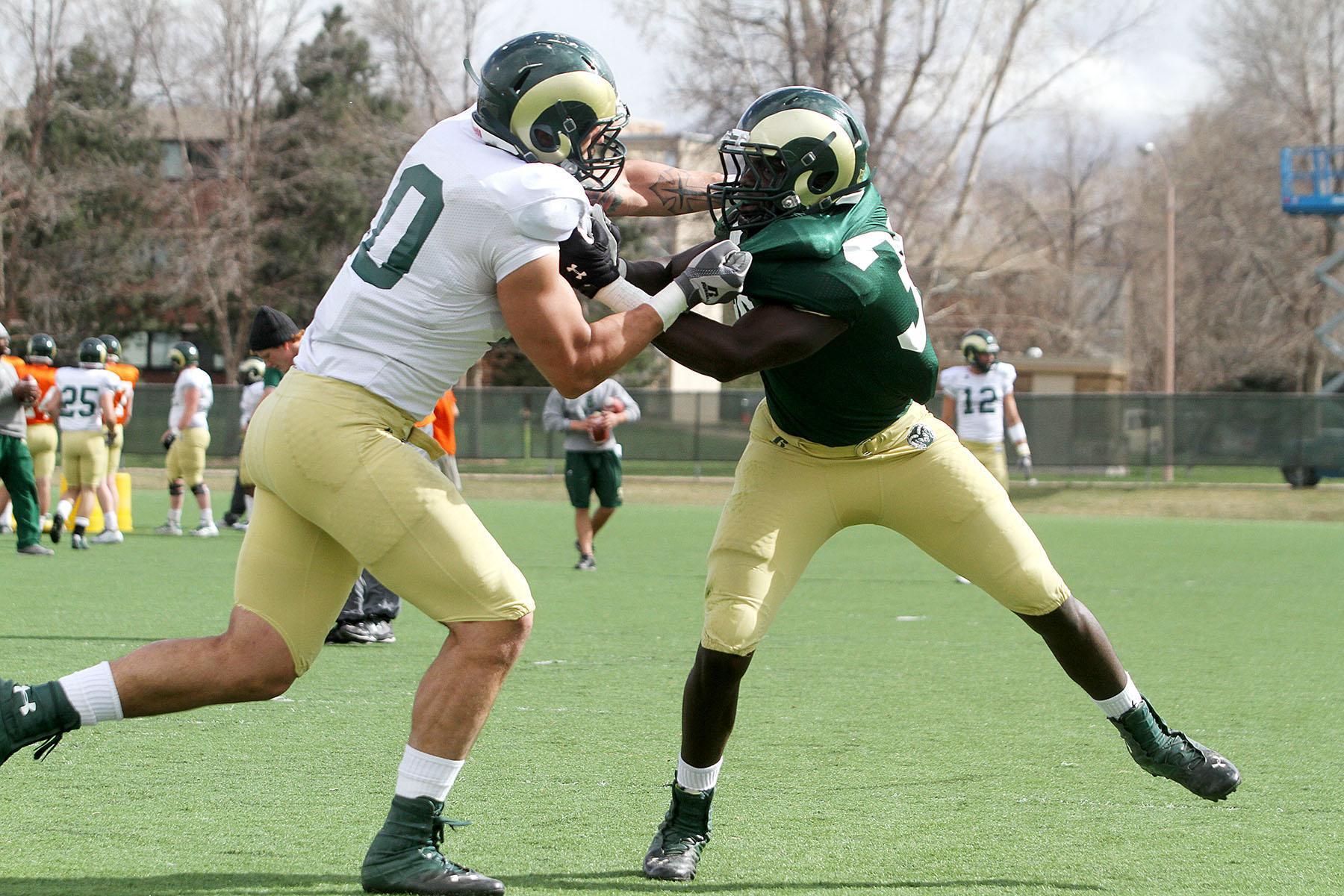 Tight end Crockett Gillmore (10) sets up a block against Bryan Ohene (36) at practice on Thursday. The Rams will have a scrimmage in Glendale, Colorado on April 12th and a scrimmage at Hughes on April 13th.