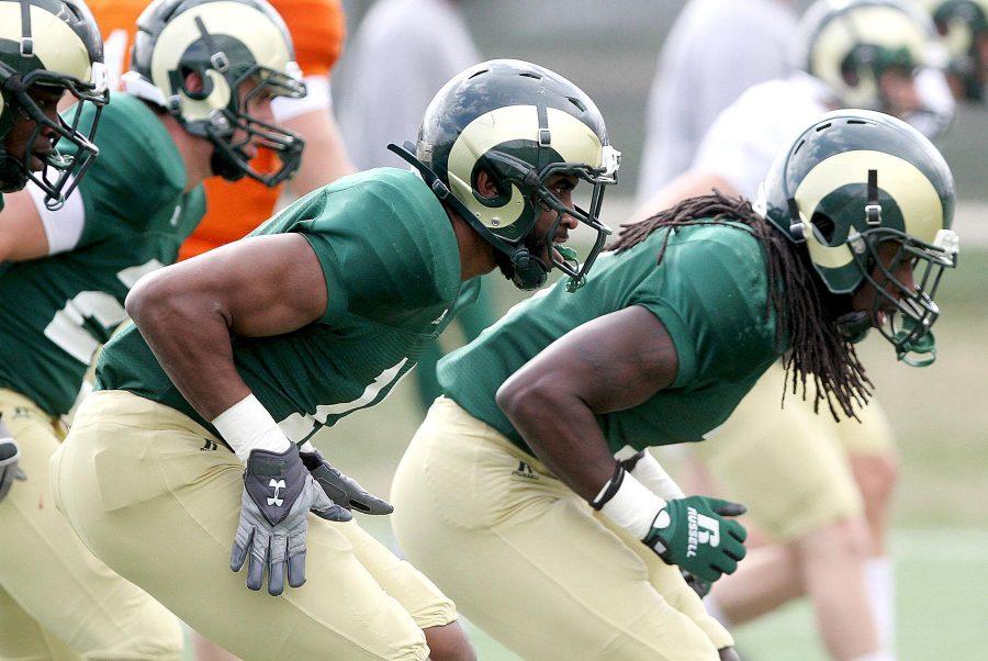 Sophomore Trent Matthews (16) warms up at practice on Thursday. The Rams prepare for another season of football ahead.