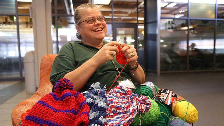 Braiden Hall Environmental Technician Ellen Becker crochets a hat in Braiden last week. Becker, who began crocheting for students 7 years ago, now makes hats for every resident in Braiden as well as Tony Frank and other prominent figures on campus.