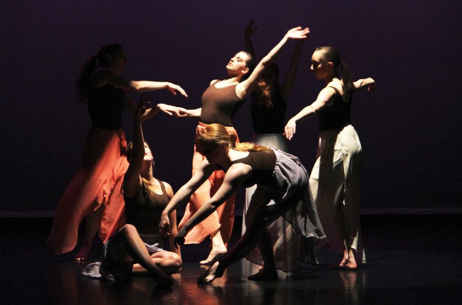 Jennifer New is surrounded by other dancers during the rehearsal of the piece 