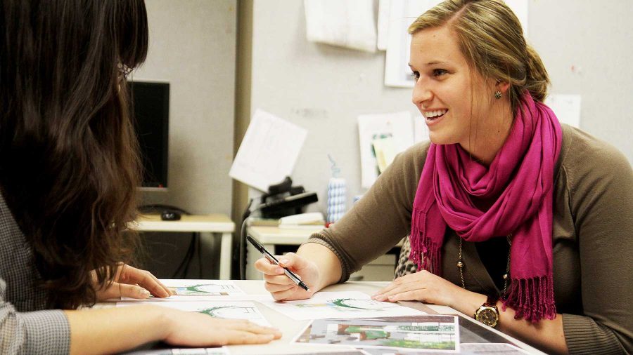 Danling Hu (left) and Emily Molzahn (right) discuss landscape concept drawings in their office in the Facilities Management building at CSU on Tuesday afternoon. Hu is a graduate landscape architect major and Molzahn is an interior design grad student.