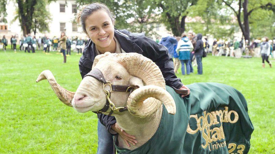 Cam the Ram handler and Animal Science major Sarah Short poses with Cam before a Colorado State University Fall Address. Cam's handlers are employed by the CSU Alumni Association and often work the job throughout their entire college career.