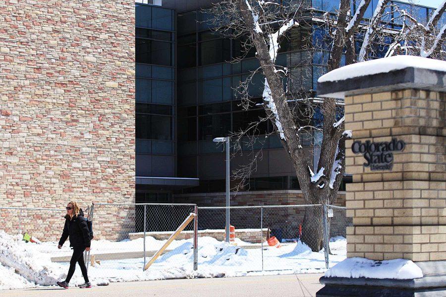 Senior Miesha Gibson walks past the new College of Engineering building on the corner of Meridian and Laurel on Tuesday. The building is nearing completion and will house the head quarters for CSUs Engineering department.