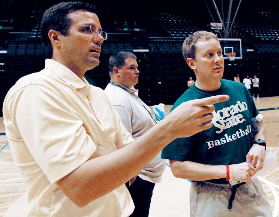 Head basketball coach Tim Miles, left, and assistant coach Niko Medved discuss players they may want to consider during open tryouts in 2007.