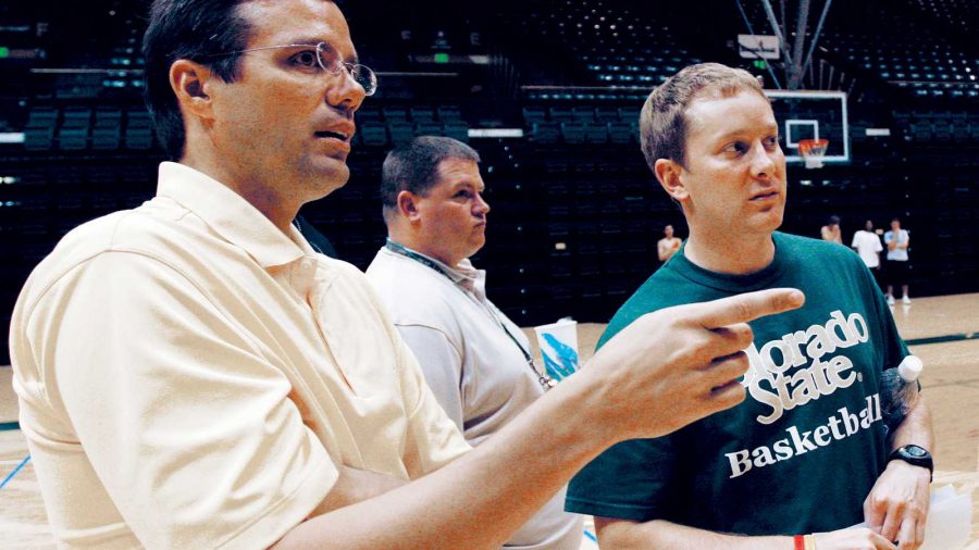 Head basketball coach Tim Miles, left, and assistant coach Niko Medved discuss players they may want to consider during open tryouts in 2007.