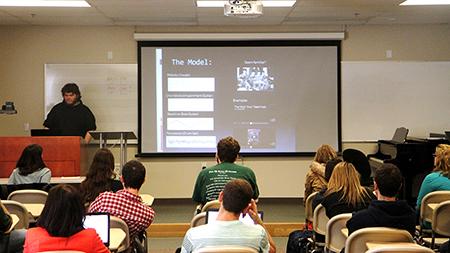 Music Composition major, Ethen Marrs, gives a presentation on the history of Chipmusic in Dr. Brewer's History of Rock and Roll class. History of Rock and Roll is one of many cool and interesting classes offered at CSU.