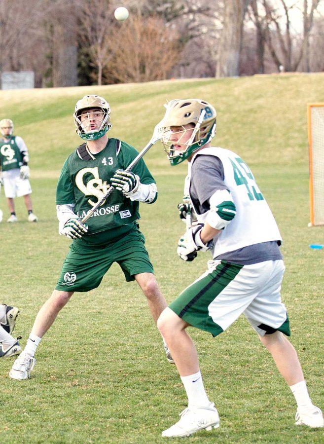 Junior midfielder Ethan Lahoda, 43, makes a pass to a teamate during lacrosse practice. Today at 4 p.m. the team will be playing in the RMLC Playoffs in Grand Junction against Utah.