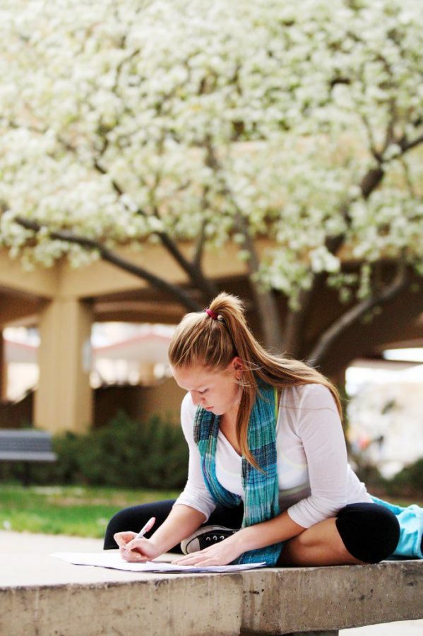 Jessica Landon enjoys the beautiful spring weather in the Clark courtyard Tuesday afternoon. Like many CSU students, Landon is cramming for her upcoming finals and excited for the summer to begin.