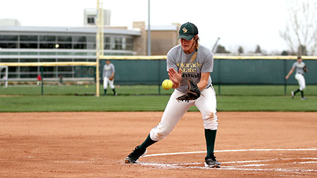 Freshman pitcher Holly Reinke catches the ball and makes a play to first base at practice last week. .