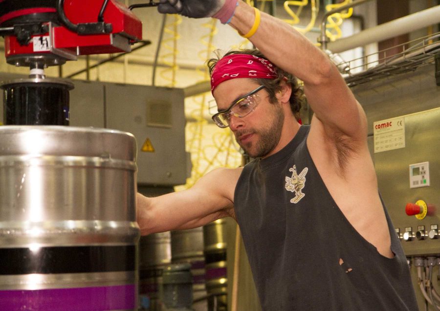 Adam Penny is filling kegs at Odell Brewing Company in Fort Collins on Wednesday