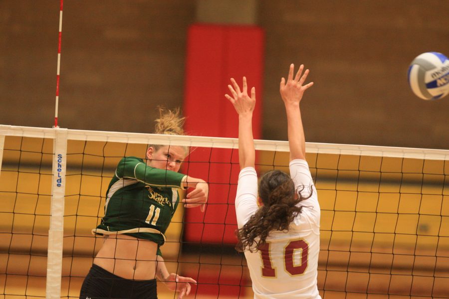 Freshman Acacia Andrews sends the ball over the net in CSU's seventh win of the season. The Rams beat the DU Pioneers in three sets to one in the game at Denver tonight.