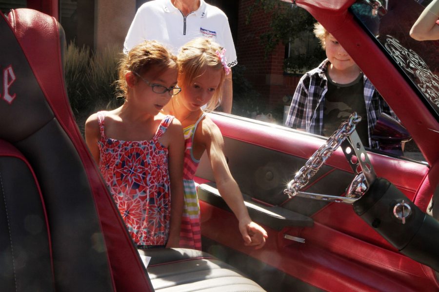 Eight-year-olds, Shelby Eley and Ella Truett, check out a suped-up purple car during the annual Nelson's Old Town Car Show this past Saturday.