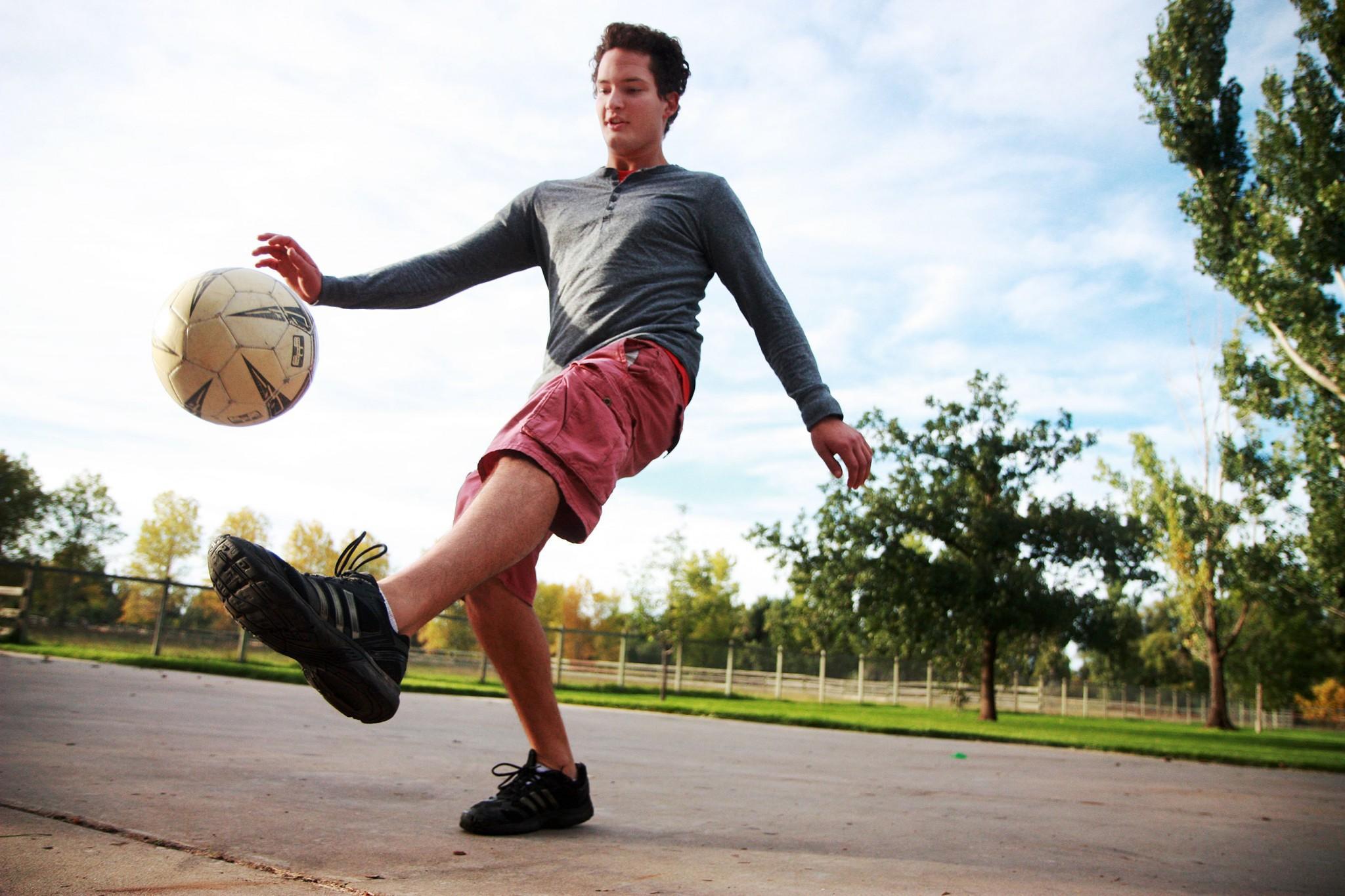Fall is setting in and Fort Collins locals are enjoying the cool weather, sunny days, and golden shimmer of changing leaves. Here, CSU graduate, Kurt Peterson, spends a lazy Sunday afternoon juggling his soccer ball at Lee Martinez Park.