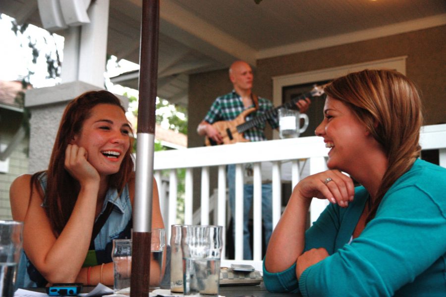 Wednesday evening, Alli Marti and Brittany Campell enjoy a girls night out at The Mayor of Old Town. Every Wednesday from 6pm to 10pm, The Mayor hosts Cigar and Pipe smoking on the patio with cool mixed drinks, 100 beers on tap, and a live band (in this photo: the Tom Barbour Trio).