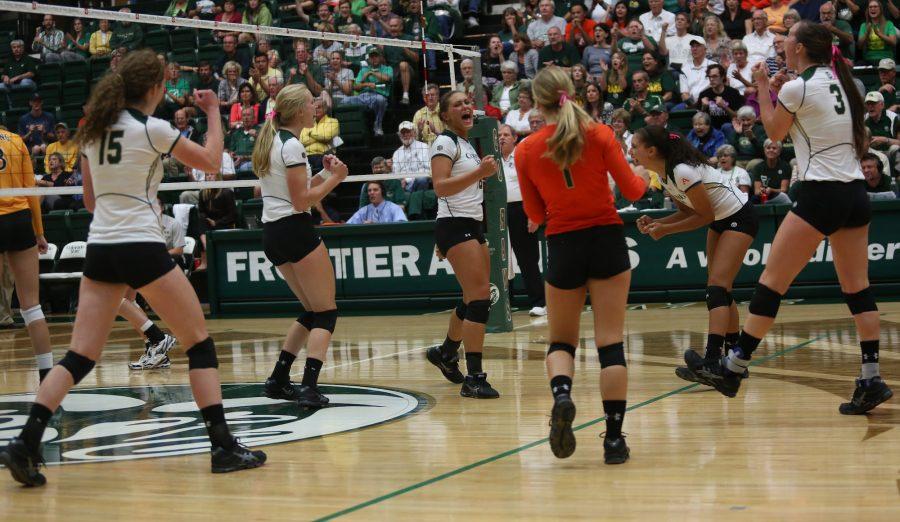 The Rams celebrate a point late in the final set of Wednesday nights match against border rival Wyoming. Despite batlling down to the last point in each set, Colorado State swept the Cowboys.