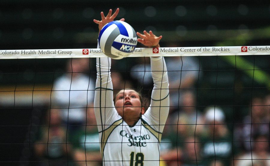 Setter Deedra Foss (18) kills a ball during the second set of Wednesday nights game against the Missouri State Bears. 