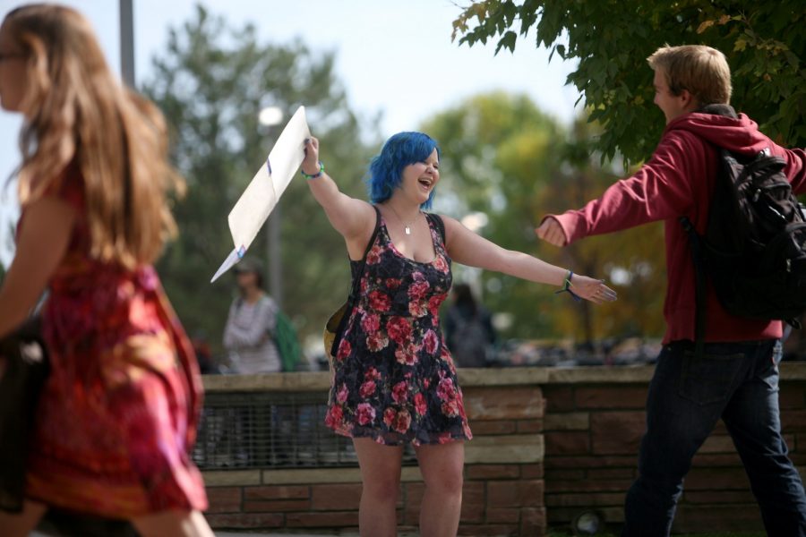 Sophomore Bailey Hohm offers a free hug to a fellow CSU student in front of the Behavorial Sciences Building Wednesday morning.