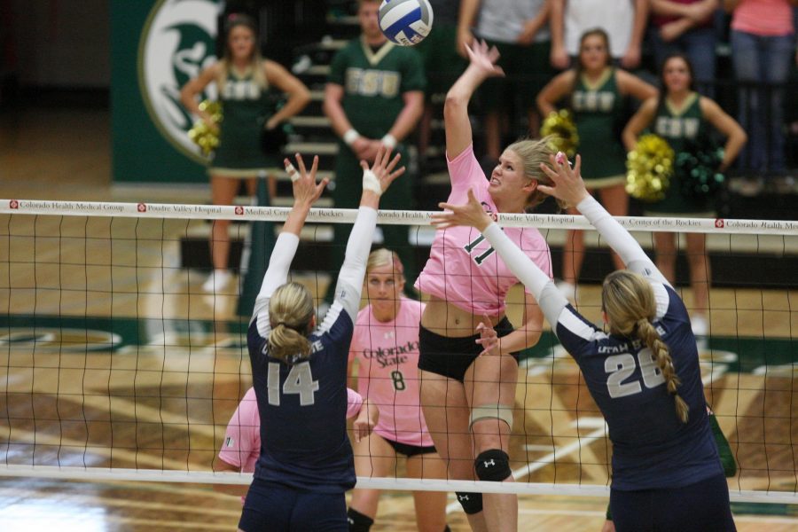 Redshirt Freshman Middle Blocker Acacia Andrews (11) winds up for a kill during the Ram win over Utah State Thursday at Moby. The Aggies took the Rams to 4 sets, but the Rams rallied for a win.