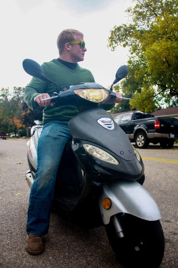 Senior accounting major Brian Cornick rides his Vespa home from classes on Tuesday afternoon. Scooters are a popular mode of transportation for students, yet the laws surrounding riding one remain unclear to many.
