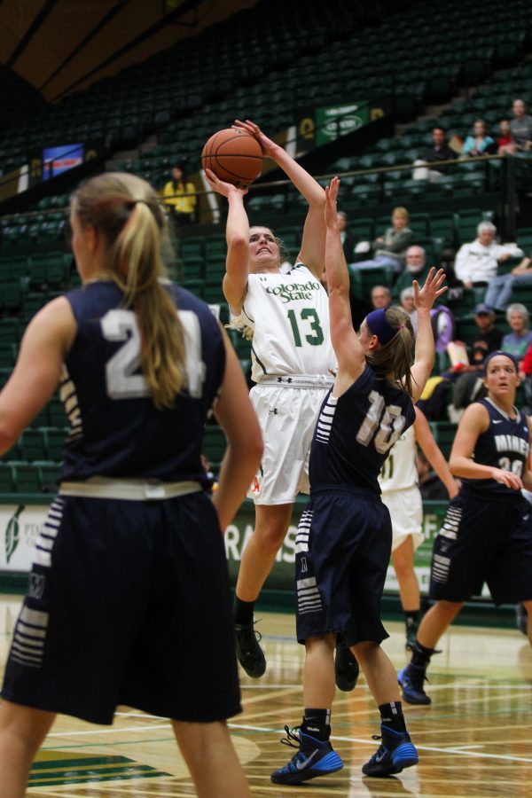 Freshman Guard Ellen Nystrom (13) shoots over the Mines defence. The Rams won over Mines 95-47 during a Women's Basketball exhibition held at Moby Monday night.