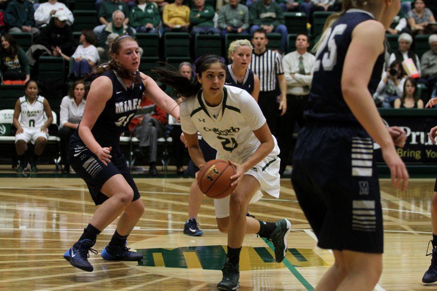Junior Forward Kara Spotton (20) moves to make a play against Mines. The Rams win over Mines 95-47 during a Women's Basketball exhibition held at Moby Monday night.