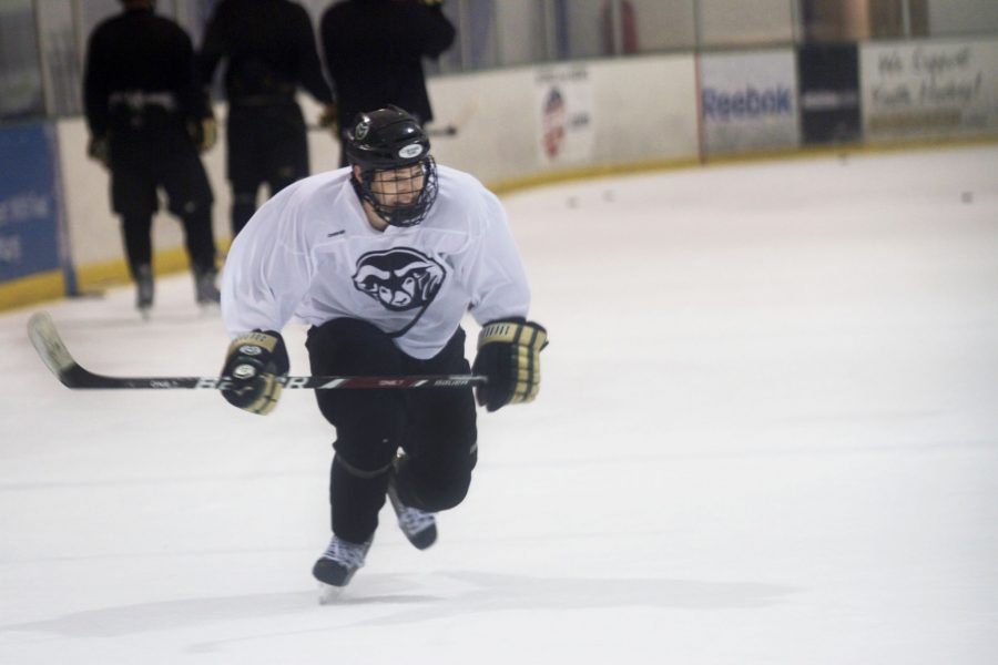 CSU hockey player roars down the rink with firece intensity during a late night practice.
