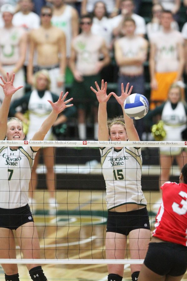 Kelsey Schnider (7) and Marnie Renyolds (15) go for a block in the last set against the New Mexico Lobos in Moby Thursday. The Rams beat the Lobos 3-1 sets, remaining undefeated.