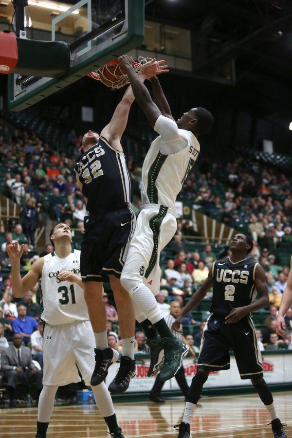 Colorado States Gerson Santo (15) dunks over UCCSs Nolan Baker (32) during the second half of Friday nights matchup in Moby Arena. The Rams rolled on the Mountain Lions 99-70 for their first win of the season.