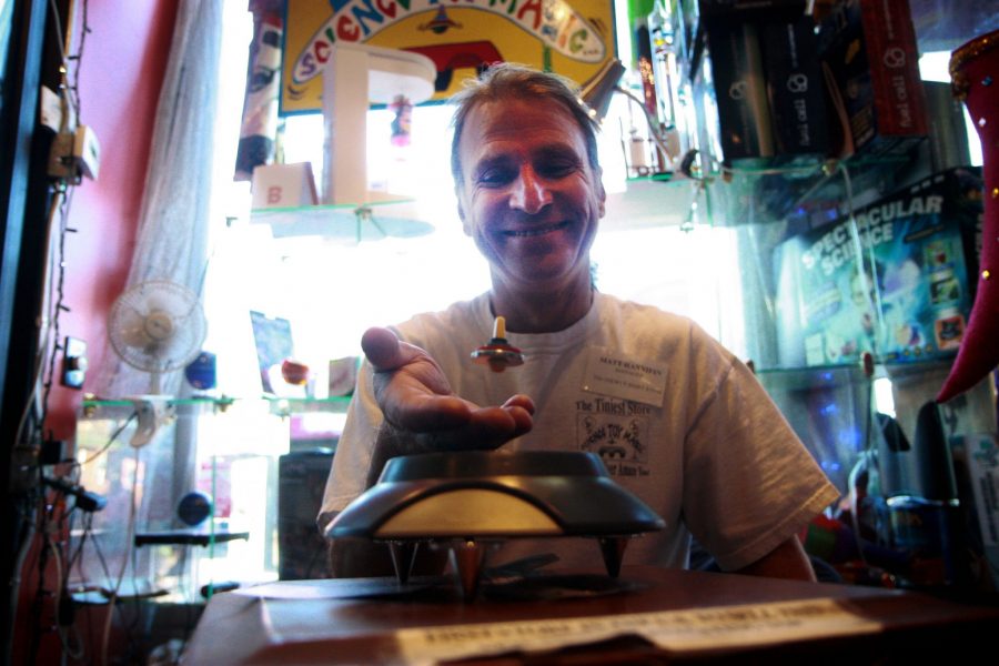 Owner of Science Toy Magic in Old Town Square, Matt Hannifin, plays with a toy he calls the "levitating top". Hannifin is proud to say that numerous toy manufactures have chosen his toy store to be the first store in the United States that they premiere their newest desgin.