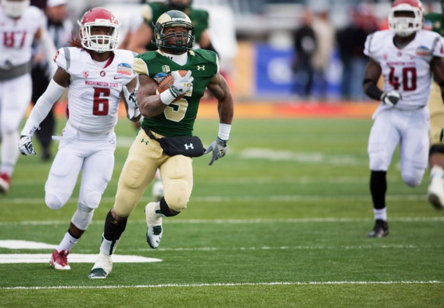Kapri Bibbs (5) breaks away from a Washington State defender during Colorado State's 48-45 victory over the Cougars in the 2013 Gildan New Mexico Bowl.