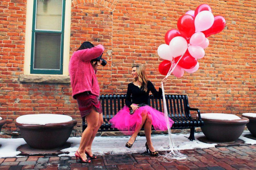 Braving the snow in heels, photographer Sally Freshour shoots sister-in-law and Fort Collins resident Rose Freshour in Old Town Wednesday. The Valentine's Day themed photo shoot was for a style spotlight on Sally's personal blog, labelleblog.com.