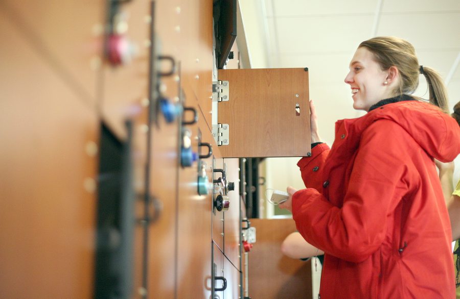 First year student Attie Pennybaker grabs her iPod out of the temporary lockers in the Recreation Center Tuesday. Lockers are available for rent each semester and sell out quickly.