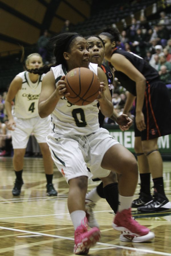 AJ Newton (0) jump stops near the block to go up for a short ranged jump stop during CSU's win  against Air Force Saturday afternoon in Moby. The Rams broke a school record, scoring 19 3-pointers in Saturday's game, of which Newton had 7.