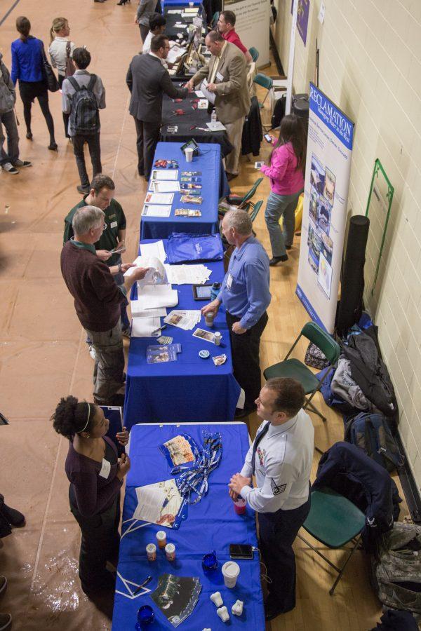 Various students talk with prospective employers at the CSU Career Fair in the intramural gym yesterday afternoon. Over 80 companies took part in the fair, offering students the oppourtunity to seek out full-time jobs, part-time jobs and internships worldwide.