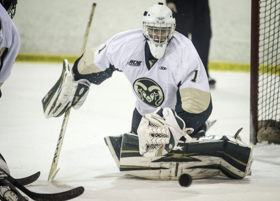 CSU goaltender Alex Steidler (1) successfully blocks the puck during Friday nights game against Arizona State. The Rams lost to the Sundevils in a shootout after a close game.