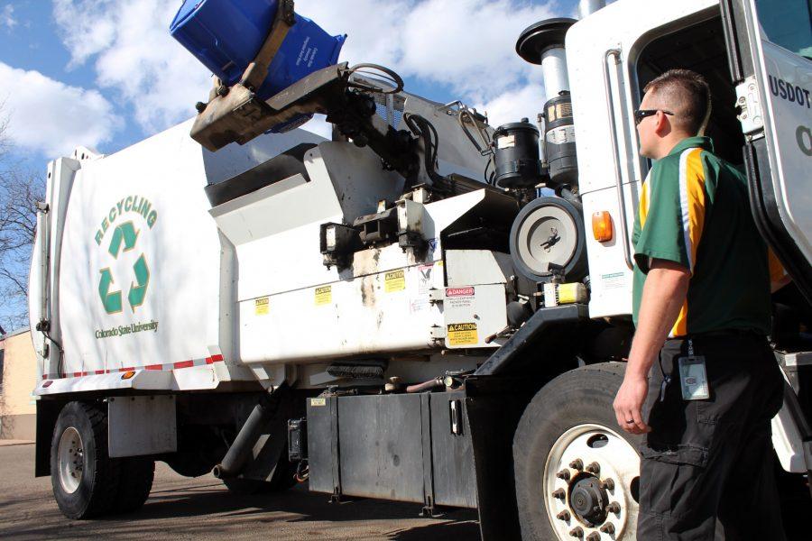Nick Dalla, a machine operator for the CSU Integrated Solid Waste Department, picks up a recycling bin at the Facilities North building on campus. The Integrated Solid Waste Department picks up recycling from approximately 60 locations around CSU's campus and Fort Collins five days a week. (Natasha Leadem | Collegian)