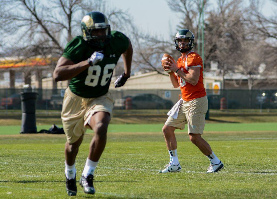 Quarterback Garrett Grayson (18) throws to tight end Brett Jordan (88) at practice this Tuesday. The Rams are getting back to practice to prepare for another season this fall.